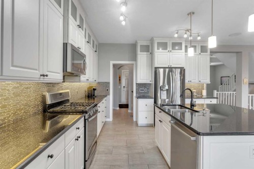 353 Kinniburgh Boulevard, Chestermere, AB - Indoor Photo Showing Kitchen With Stainless Steel Kitchen With Upgraded Kitchen