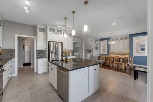 353 Kinniburgh Boulevard, Chestermere, AB - Indoor Photo Showing Kitchen With Stainless Steel Kitchen With Upgraded Kitchen