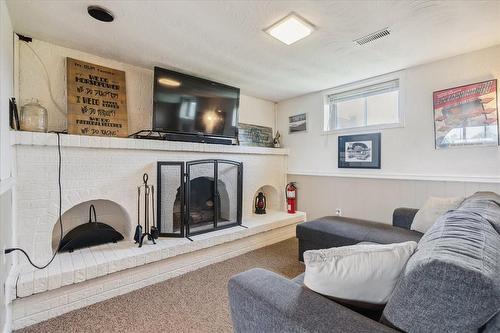 251 Green Mountain Road E, Stoney Creek, ON - Indoor Photo Showing Living Room With Fireplace