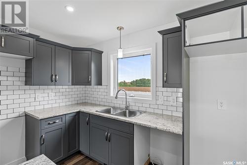 309 Reddekopp Crescent, Warman, SK - Indoor Photo Showing Kitchen With Double Sink