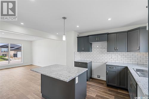 309 Reddekopp Crescent, Warman, SK - Indoor Photo Showing Kitchen With Double Sink With Upgraded Kitchen