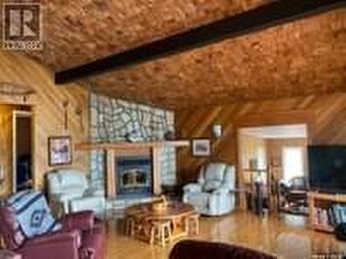 Arrowhead Island, Lac La Ronge, SK - Indoor Photo Showing Living Room With Fireplace