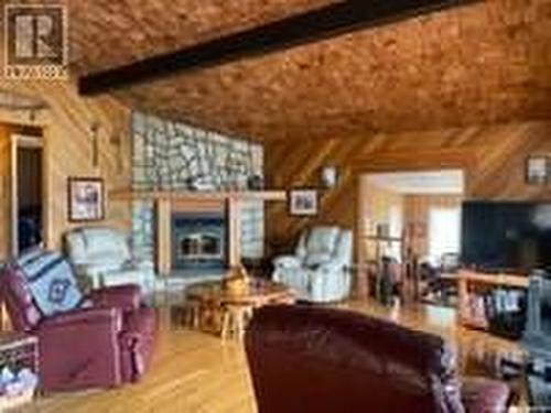 Arrowhead Island, Lac La Ronge, SK - Indoor Photo Showing Living Room With Fireplace